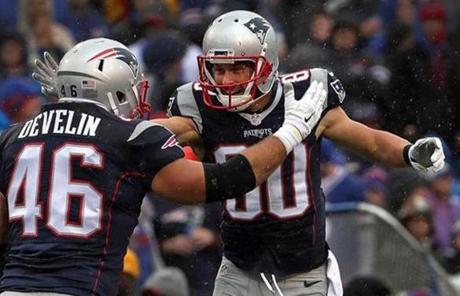 Orchard Park, NY - 10/30/2016 - (1st quarter) New England Patriots wide receiver Danny Amendola (80) celebrates with New England Patriots fullback James Develin (46) after Amendola's 9 yard touchdown reception during the first quarter. The Buffalo Bills host the New England Patriots at New Era Field in Orchard Park, NY. - (Barry Chin/Globe Staff), Section: Sports, Reporter: Ben Volin, Topic: 31Patriots-Bills, LOID: 8.3.470379750.
